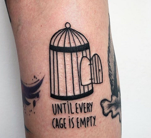 until every cage is free tattoo